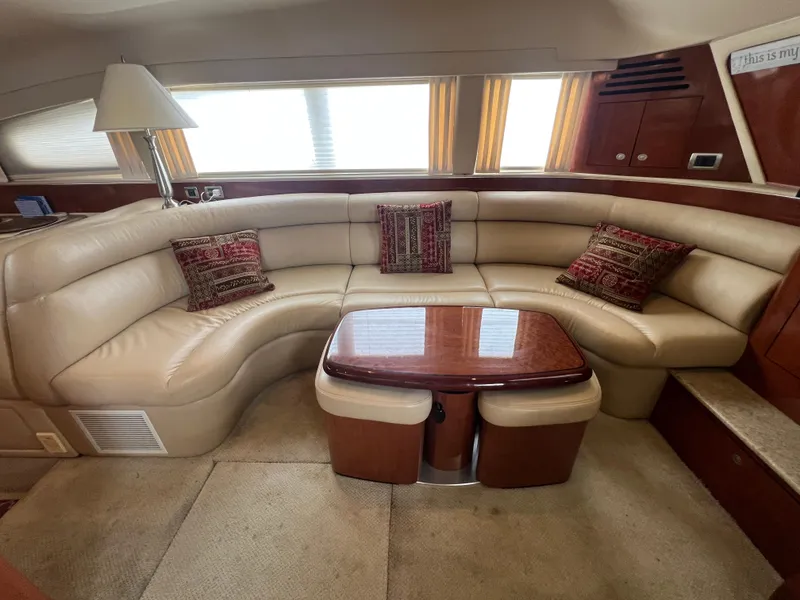 Slide: The Image of Luxurious interior of 2004 Sea Ray 480 Motor Yacht with plush seating and elegant table. - 30