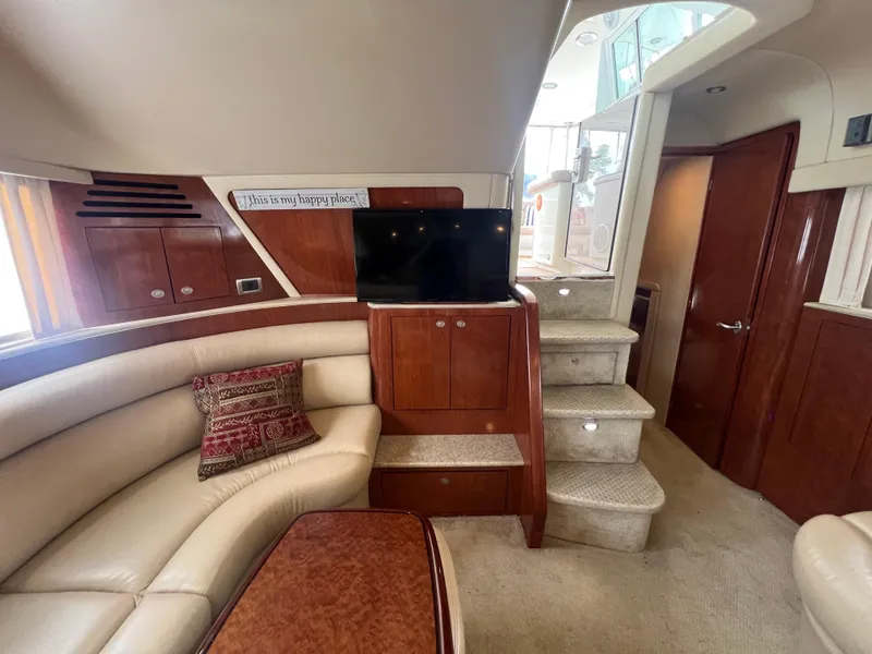 Slide: The Image of Luxurious interior of 2004 Sea Ray 480 Motor Yacht with plush seating and elegant wood finishes. - 31