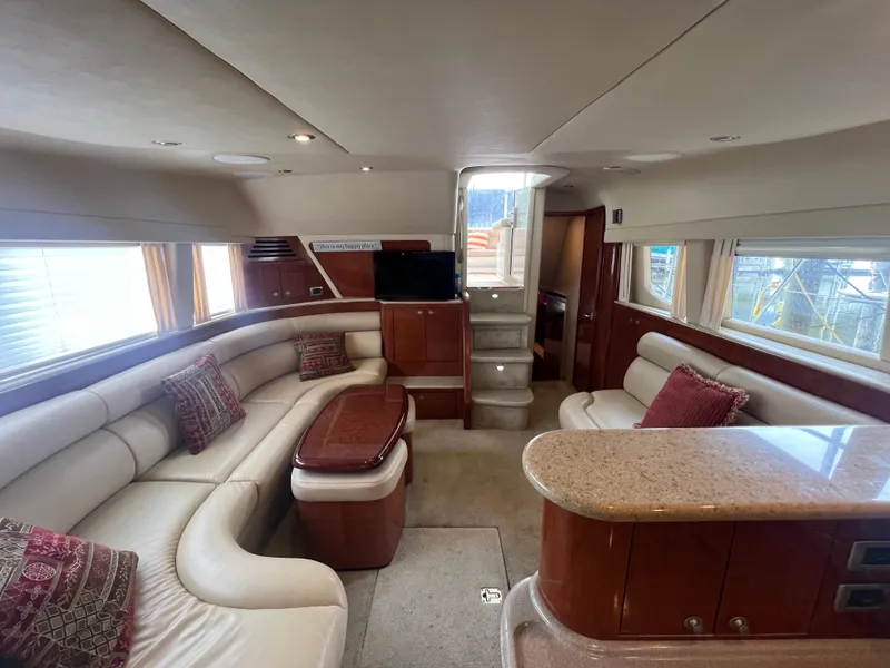 Slide: The Image of Luxurious interior of 2004 Sea Ray 480 Motor Yacht with plush seating and elegant decor. - 33