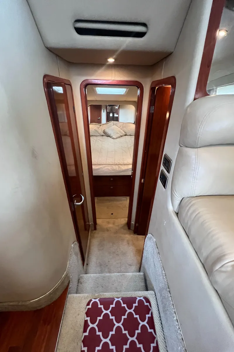 Slide: The Image of Interior of 2004 Sea Ray 480 Motor Yacht showing cabin entrance and stairs. - 37