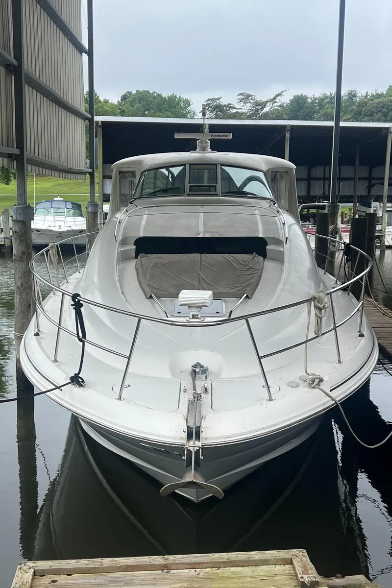 Slide: The Image of 2004 Sea Ray 480 Motor Yacht docked in a marina, front view. - 4