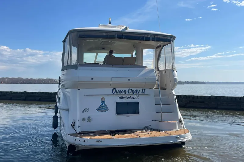Slide: The Image of 2004 Sea Ray 480 Motor Yacht docked, rear view with clear skies. - 73
