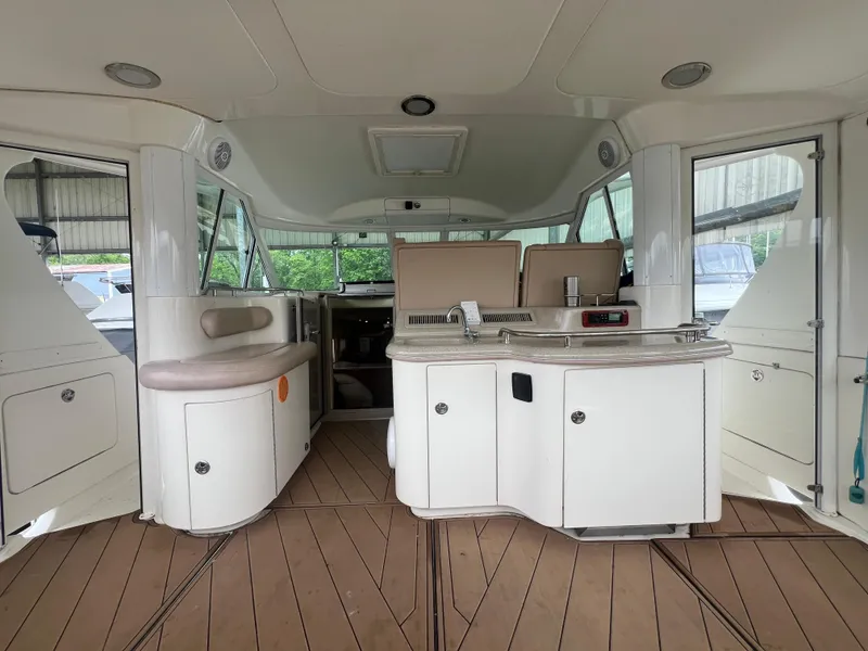 Slide: The Image of 2004 Sea Ray 480 Motor Yacht interior with seating and kitchenette. - 8