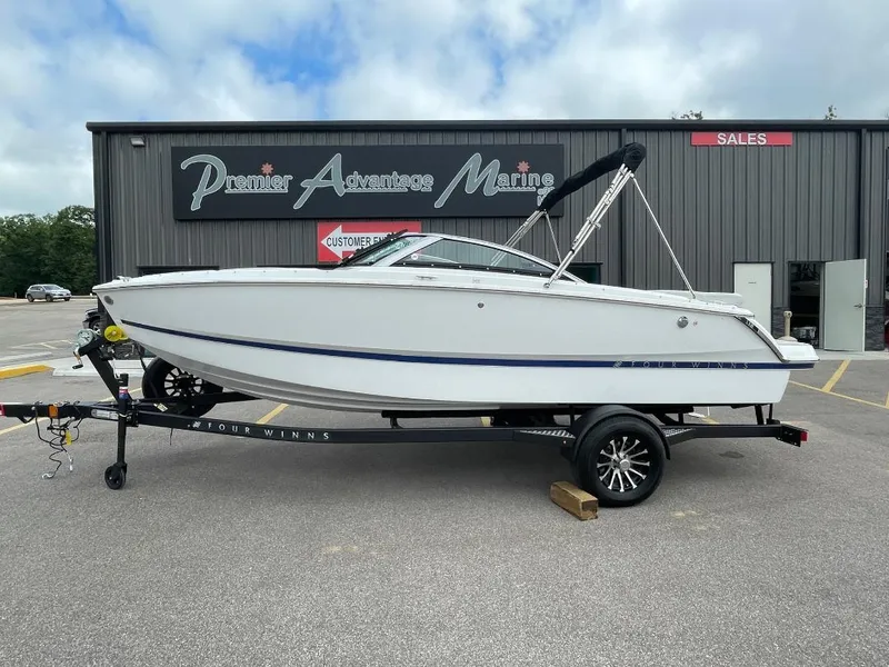 The Image of 2025 Four Winns H1 boat on trailer at Premier Advantage Marine dealership. - 0