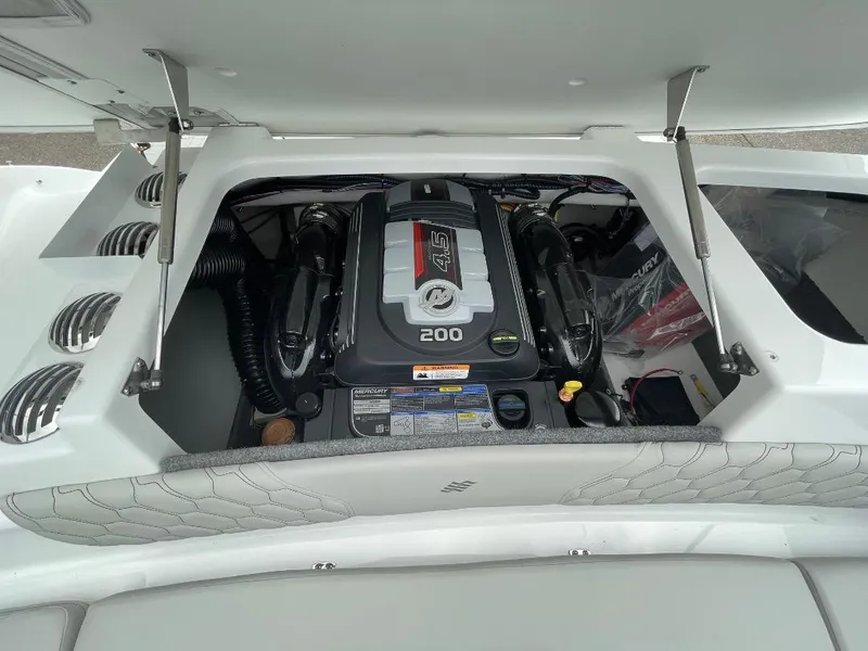 Slide: The Image of 2025 Four Winns H1 boat engine compartment with Mercury 4.5L 200 HP engine. - 10