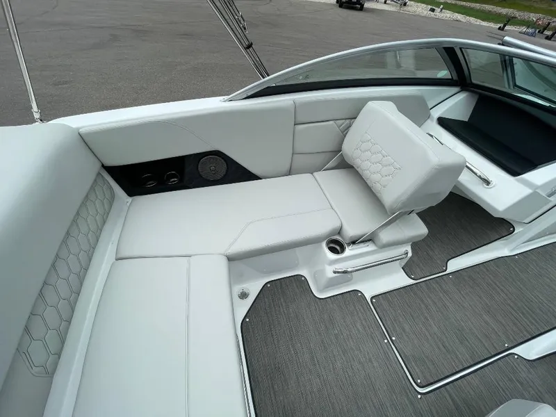 Slide: The Image of 2025 Four Winns H1 boat interior with sleek white seating and modern design. - 9
