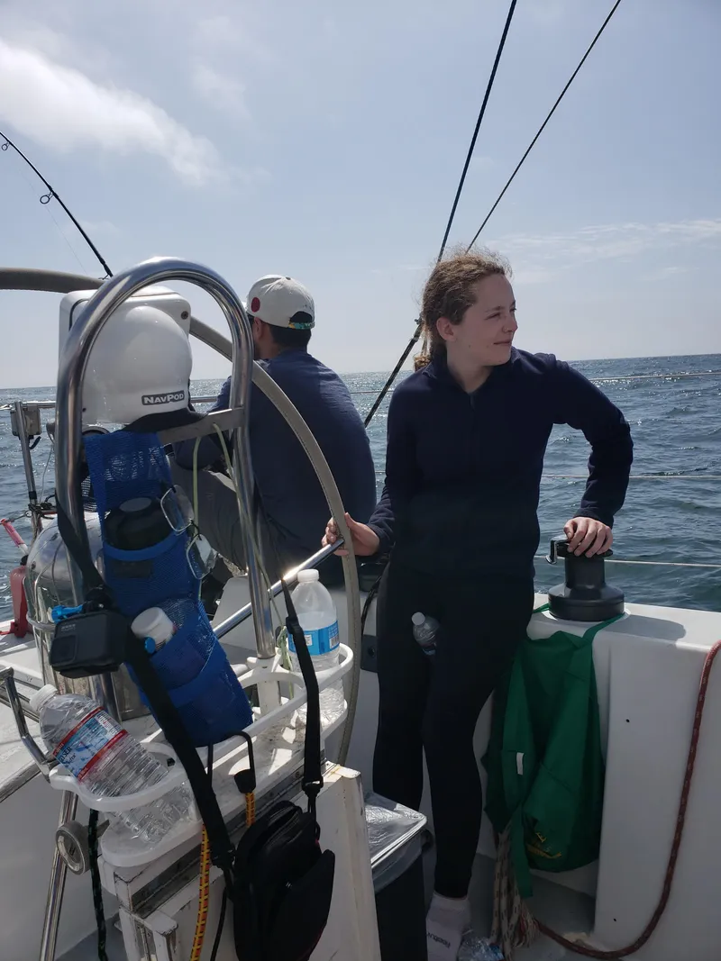 Slide: The Image of Two people sailing on a 1986 Santa Cruz 50 yacht, enjoying a sunny day at sea. - 7