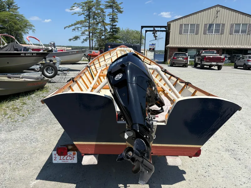 Slide: The Image of Custom Houghs Neck Skiff 176 boat with outboard motor on trailer, 2017 model. - 2