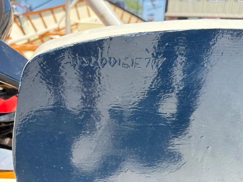 Slide: The Image of Close-up of a 2017 Custom Houghs Neck Skiff 176 boat hull with engraved details. - 6