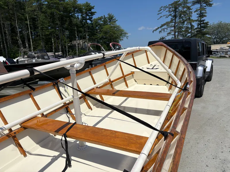 Slide: The Image of Custom 2017 Houghs Neck Skiff 176 on trailer, wooden interior, outdoors. - 8