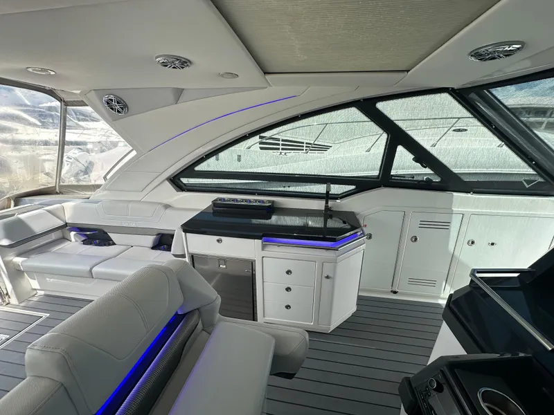 Slide: The Image of 2021 Formula 400 Super Sport Crossover yacht interior with modern seating and sleek design. - 15