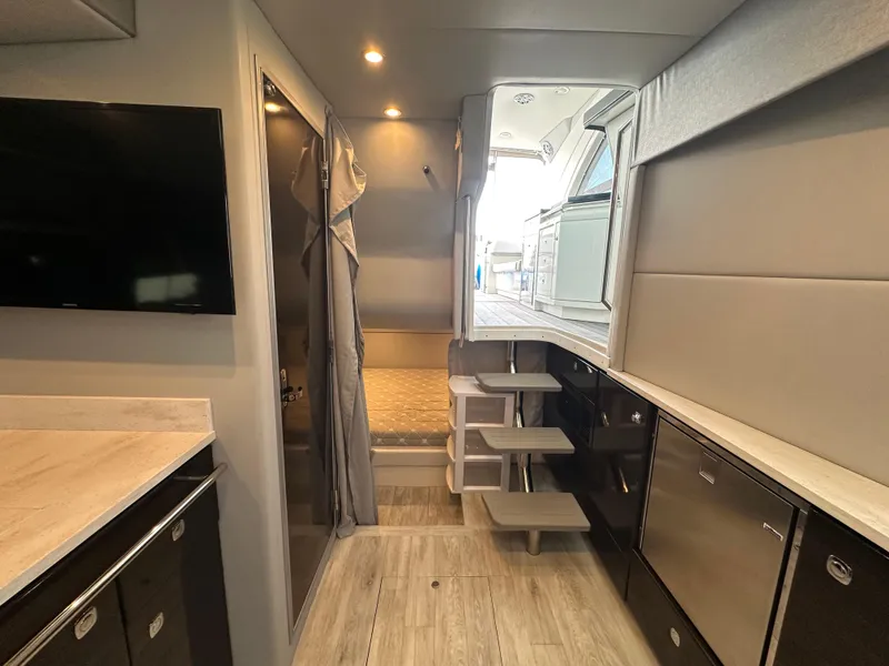 Slide: The Image of Interior of 2021 Formula 400 Super Sport Crossover yacht with modern amenities and sleek design. - 18