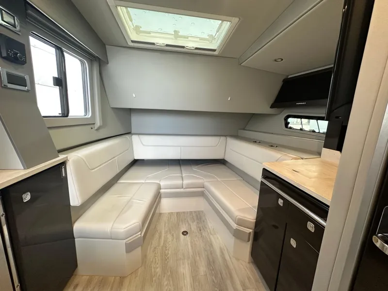 Slide: The Image of 2021 Formula 400 Super Sport Crossover interior with modern seating and skylight. - 19