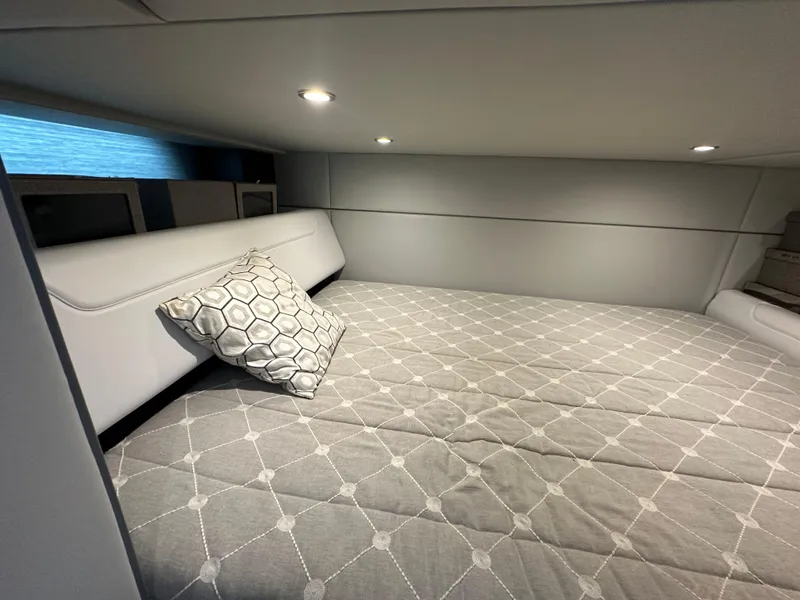 Slide: The Image of 2021 Formula 400 Super Sport Crossover cabin interior with bed and geometric pillow. - 21