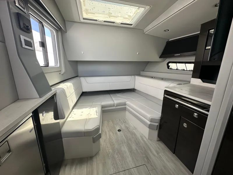 Slide: The Image of Luxurious interior of 2021 Formula 400 Super Sport Crossover yacht with modern seating and cabinetry. - 23