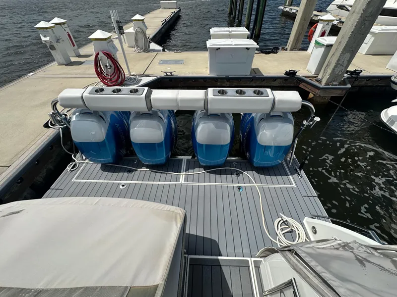 Slide: The Image of 2021 Formula 400 Super Sport Crossover with four outboard engines docked at marina. - 3