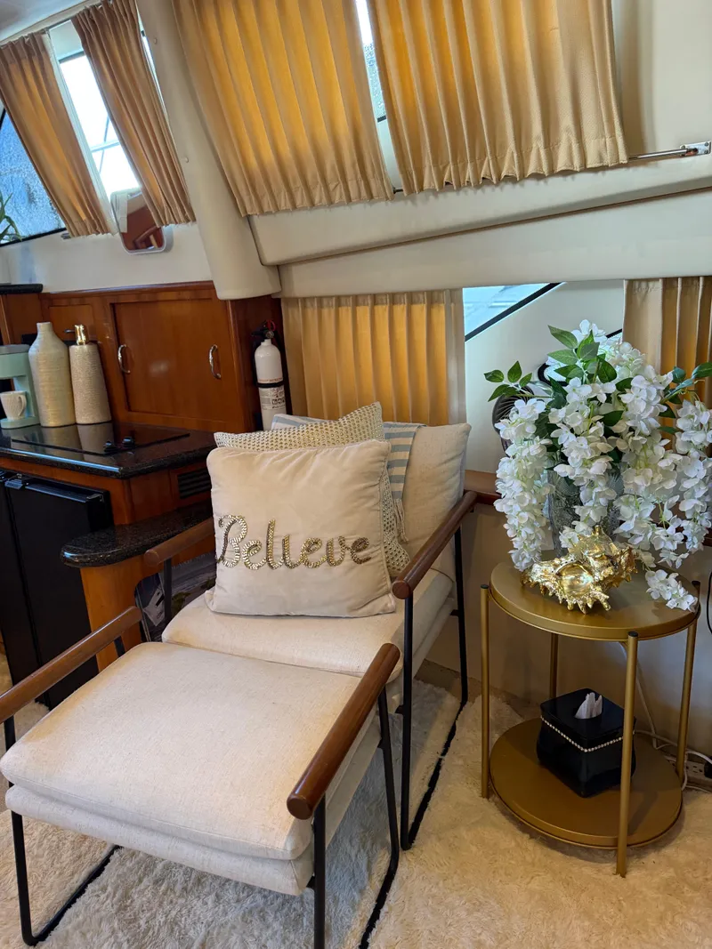 Slide: The Image of Interior of 2006 Carver 41 Cockpit Motor Yacht with cozy seating and decorative accents. - 11