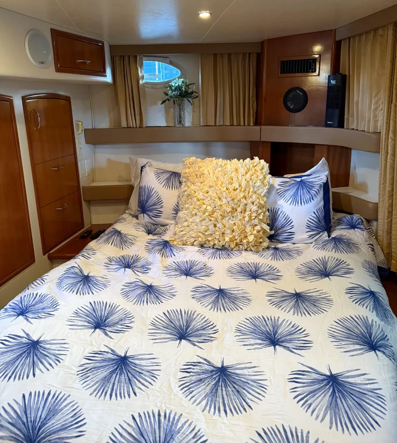 Slide: The Image of Luxurious bedroom in 2006 Carver 41 Cockpit Motor Yacht with stylish bedding and decor. - 19