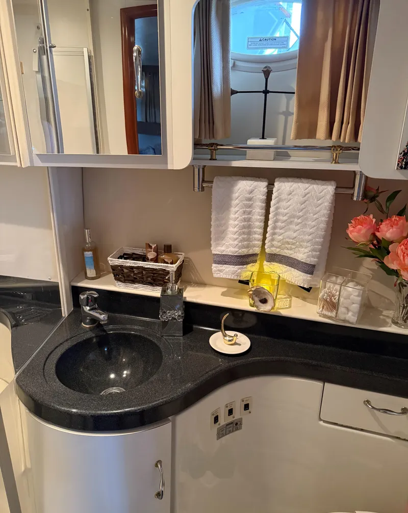 Slide: The Image of Luxurious bathroom in 2006 Carver 41 Cockpit Motor Yacht with elegant decor and amenities. - 21