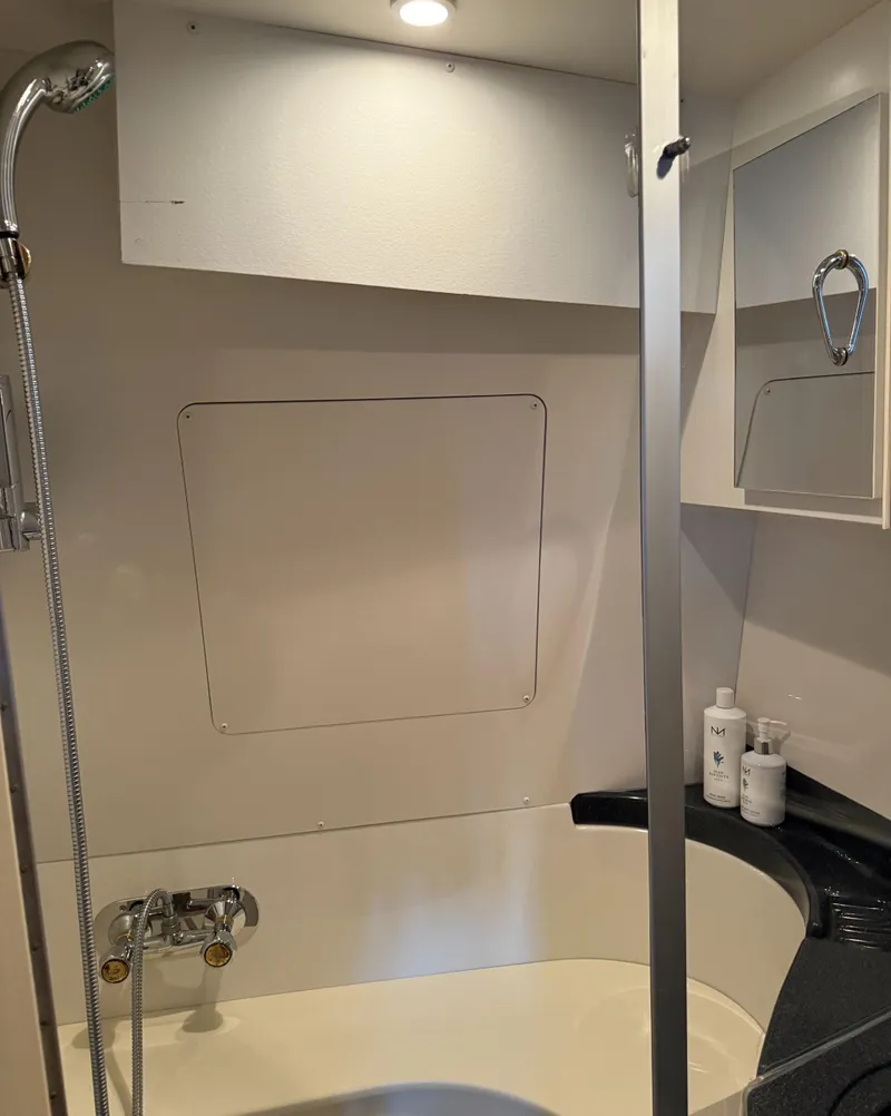 Slide: The Image of Bathroom interior of 2006 Carver 41 Cockpit Motor Yacht with shower and vanity. - 23