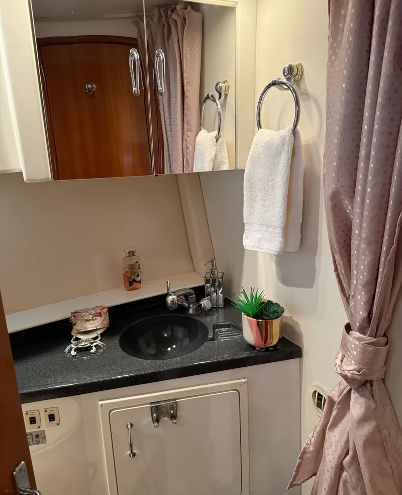 Slide: The Image of Luxurious bathroom in 2006 Carver 41 Cockpit Motor Yacht with elegant fixtures. - 26