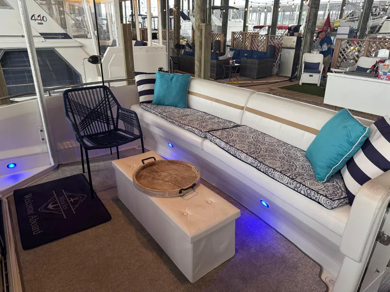 Slide: The Image of Luxurious 2006 Carver 41 Cockpit Motor Yacht interior with elegant seating and decor. - 33