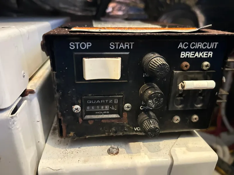 Slide: The Image of Control panel of a 2006 Carver 41 Cockpit Motor Yacht with switches and circuit breaker. - 43