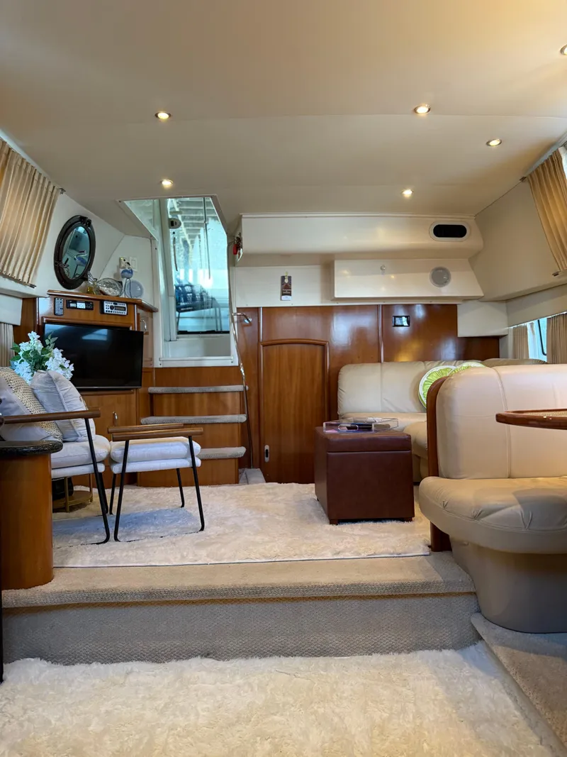 Slide: The Image of Luxurious interior of 2006 Carver 41 Cockpit Motor Yacht with elegant seating and decor. - 6
