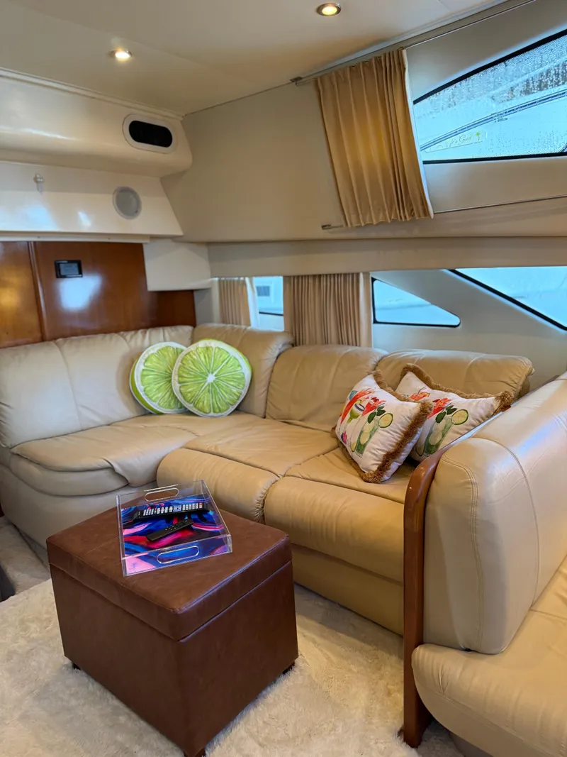 Slide: The Image of Luxurious interior of 2006 Carver 41 Cockpit Motor Yacht with plush seating and decorative pillows. - 7