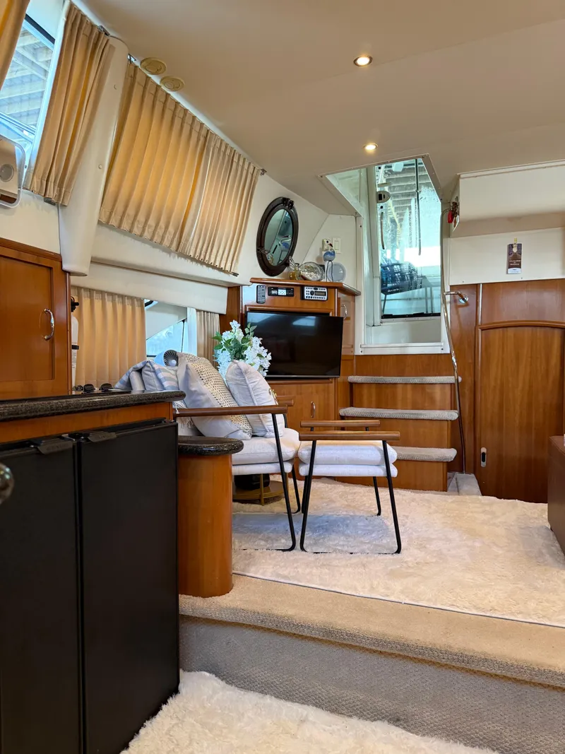 Slide: The Image of Luxurious interior of 2006 Carver 41 Cockpit Motor Yacht with elegant furnishings and decor. - 14