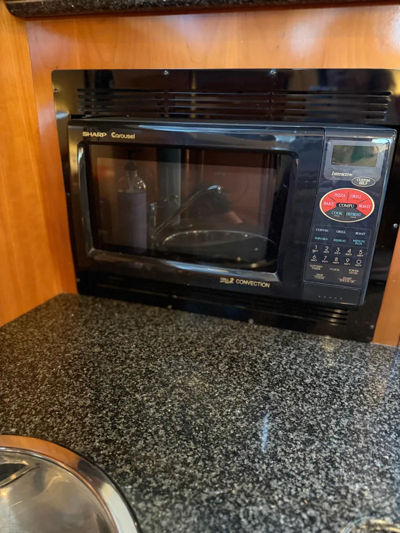 Slide: The Image of Sharp Carousel microwave in 2006 Carver 41 Cockpit Motor Yacht kitchen. - 17