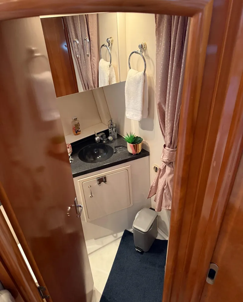 Slide: The Image of Bathroom interior of 2006 Carver 41 Cockpit Motor Yacht with sink and mirror. - 25