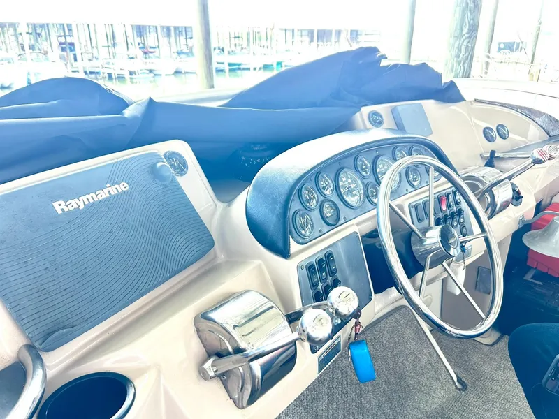 Slide: The Image of 2006 Carver 41 Cockpit Motor Yacht helm with Raymarine navigation system and control panel. - 31