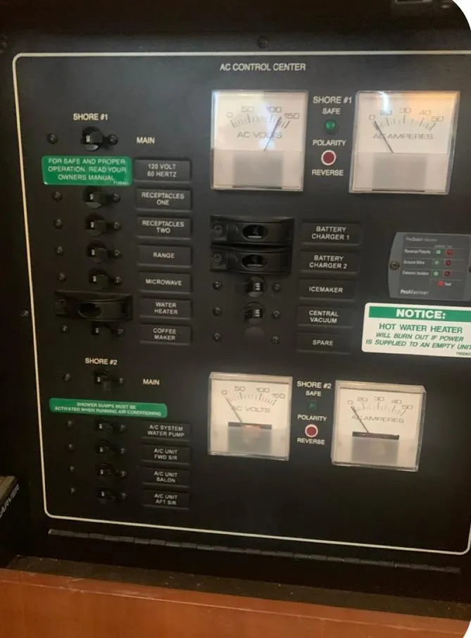 Slide: The Image of Control panel of a 2006 Carver 41 Cockpit Motor Yacht, featuring AC control center. - 37