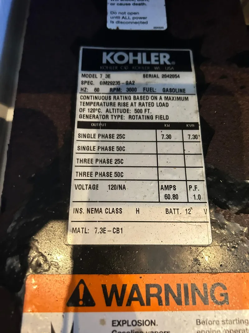 Slide: The Image of Kohler generator label on 2006 Carver 41 Cockpit Motor Yacht, model 7.3E, gasoline-powered. - 44