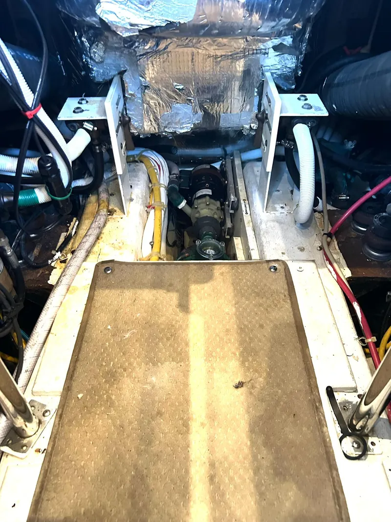 Slide: The Image of Engine room of 2006 Carver 41 Cockpit Motor Yacht, showing mechanical components and wiring. - 45