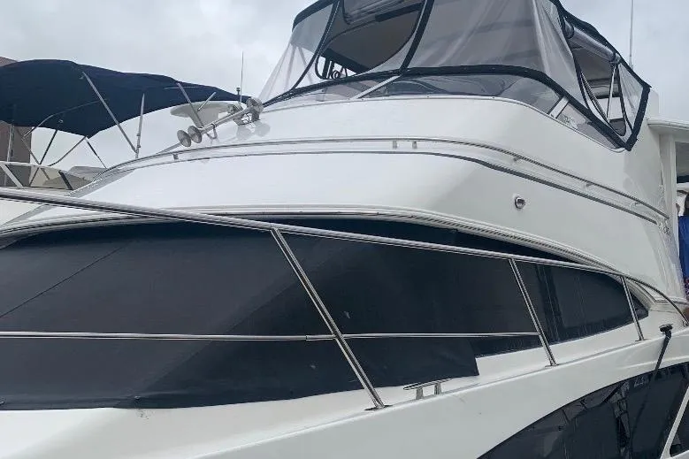 Slide: The Image of 2006 Carver 41 Cockpit Motor Yacht with sleek design and covered cockpit. - 55