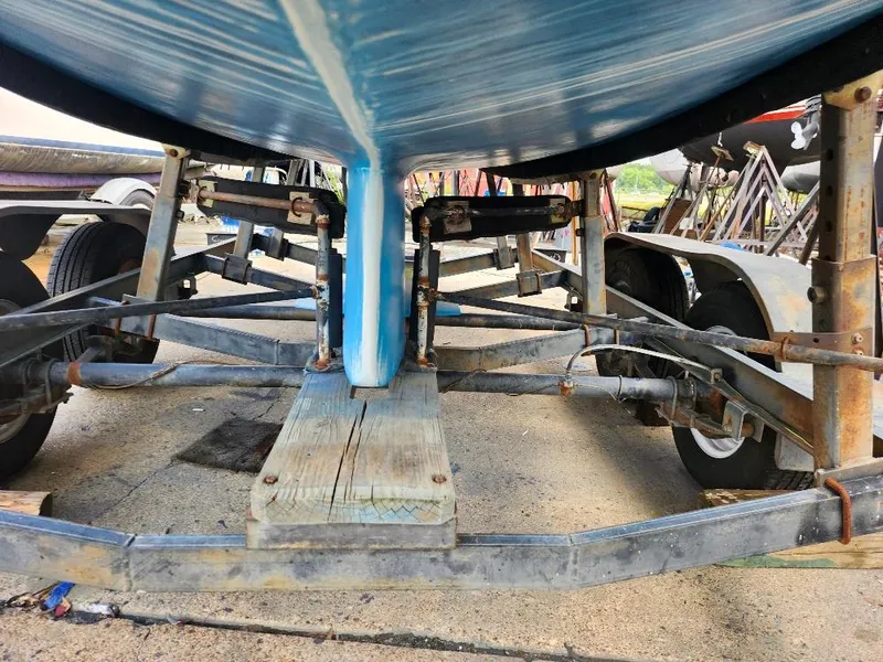 Slide: The Image of Underside view of a 1988 Hunter 23 boat on a trailer. - 15