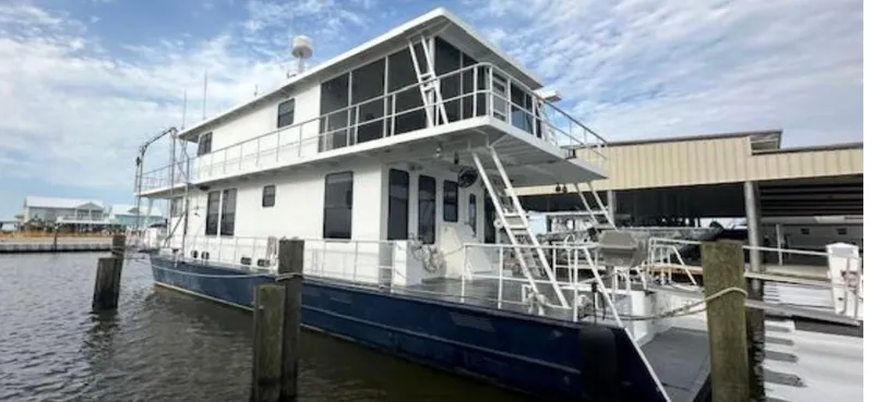 The Image of Custom 2003 houseboat docked at marina, featuring two stories and white exterior. - 0