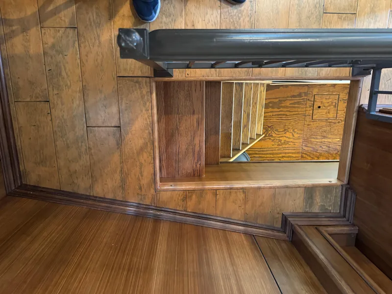 Slide: The Image of Wooden staircase on a 2003 custom houseboat, viewed from above. - 13