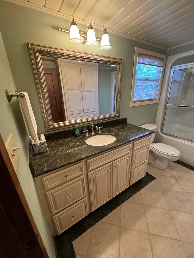 Slide: The Image of Elegant houseboat bathroom with granite countertop, large mirror, and modern fixtures, 2003 model. - 19