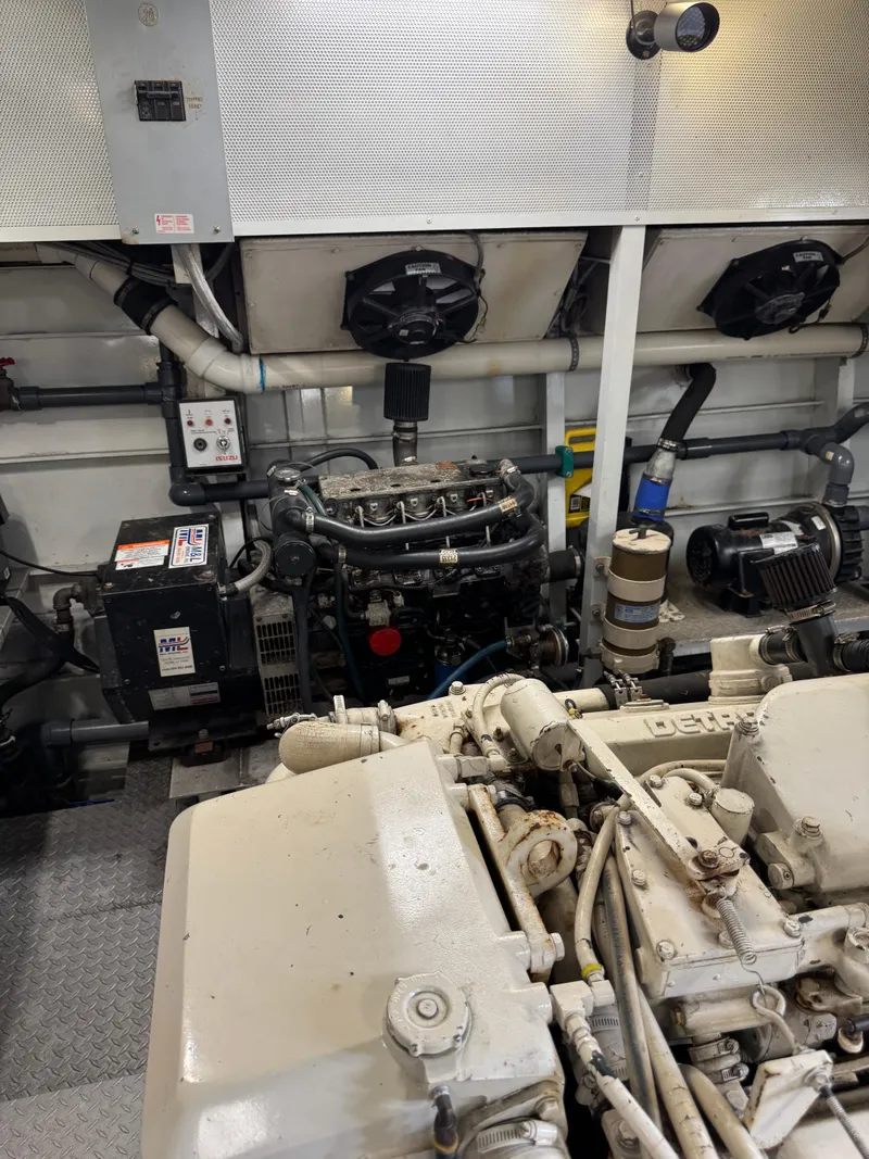 Slide: The Image of Engine room of a 2003 custom houseboat with visible machinery and components. - 45