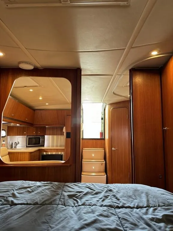 Slide: The Image of 2004 Tiara Yachts 3600 Sovran interior with wood finish and modern kitchen amenities. - 23