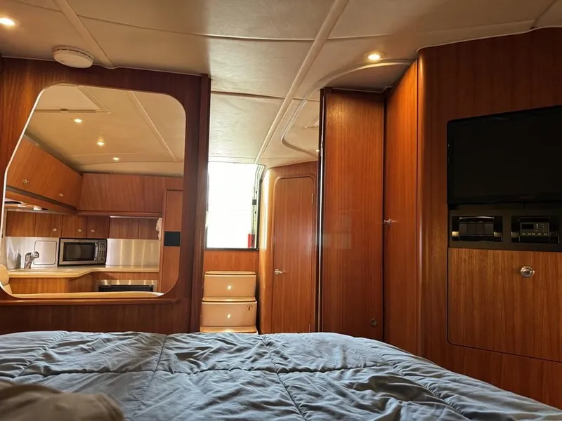 Slide: The Image of Interior of 2004 Tiara Yachts 3600 Sovran, featuring wood paneling and modern amenities. - 24