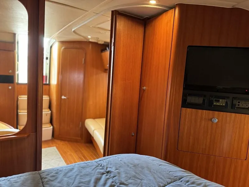 Slide: The Image of 2004 Tiara Yachts 3600 Sovran interior with wood paneling and modern amenities. - 25