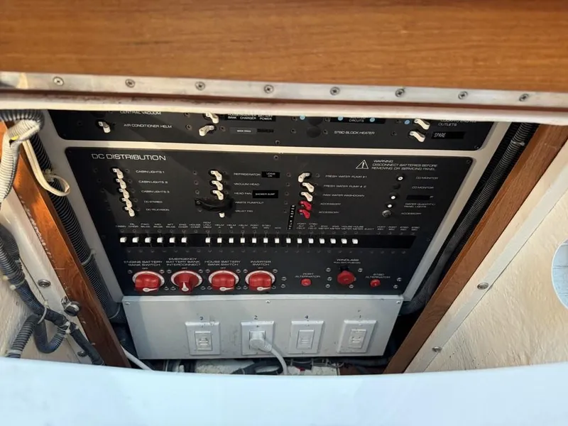 Slide: The Image of Electrical panel of a 2004 Tiara Yachts 3600 Sovran, featuring DC distribution controls. - 34