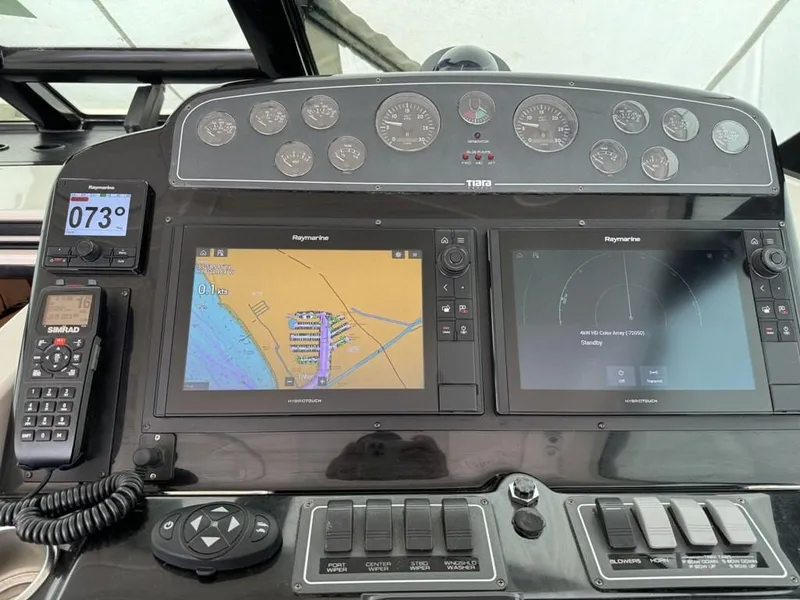 Slide: The Image of 2004 Tiara Yachts 3600 Sovran dashboard with navigation and control systems. - 5