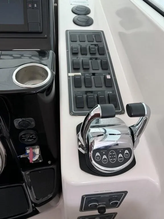 Slide: The Image of Control panel of a 2004 Tiara Yachts 3600 Sovran with throttle and switches. - 7
