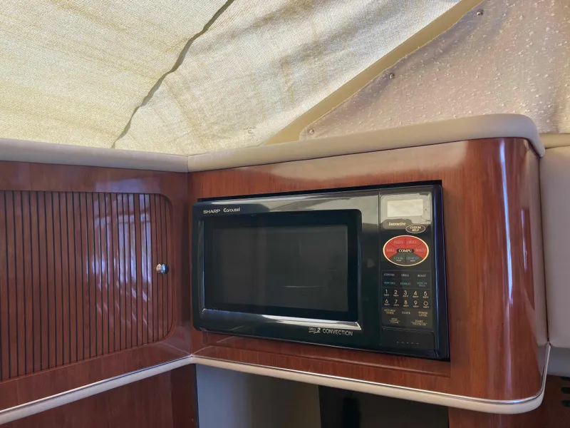 Slide: The Image of Microwave in 2004 Sea Ray 400 Bridge Deck yacht kitchen area. - 23