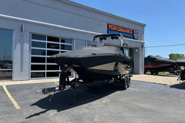 Slide: The Image of 2022 MasterCraft XStar S boat on trailer outside dealership. - 15